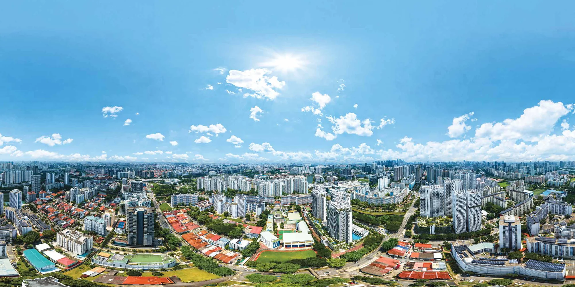 Aerial view over the Boon Keng and Bendemeer neighbourhood, looking towards the city skyline.