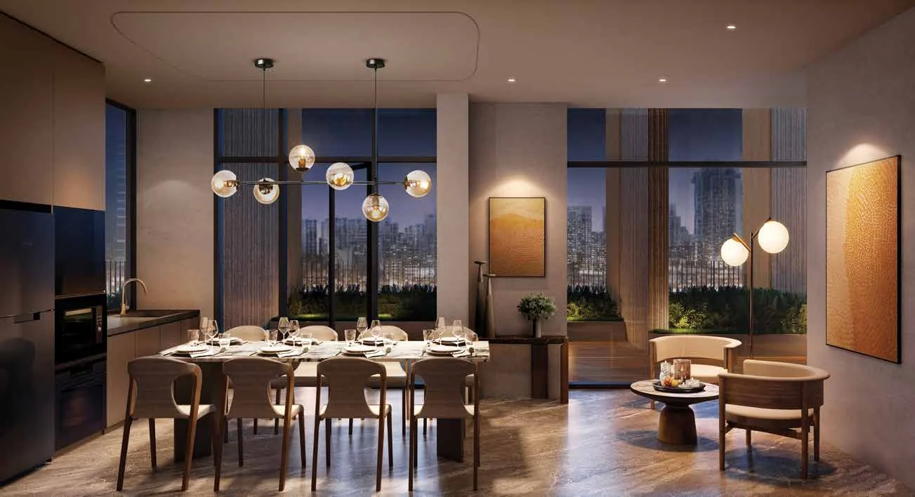 A dining room set for eight with pendant lights and city views at dusk, on the 14th-storey sky terrace.